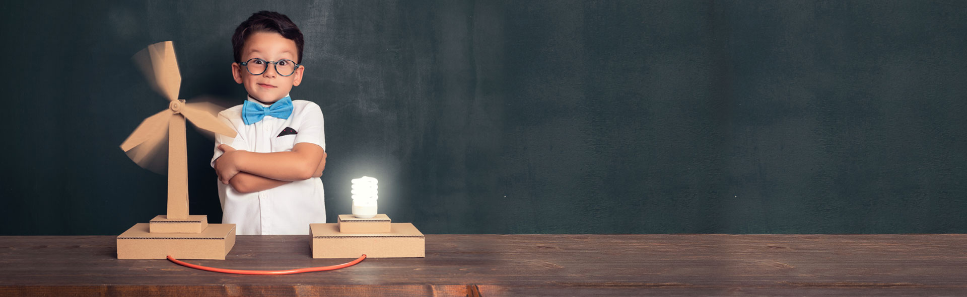 Kid Standing In Front Of Electricity Generated Fan
